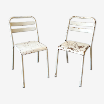 Pair of white metal bistro chairs