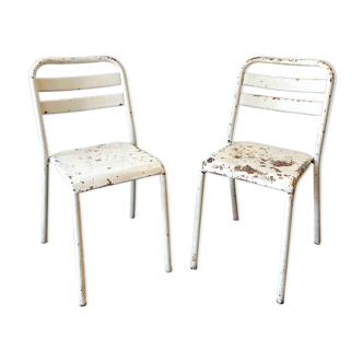 Pair of white metal bistro chairs