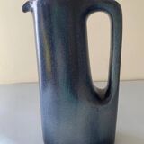 Sleek shaped pitcher in blue shaded ceramic. Signed under the base Stocker Fred and Andrée