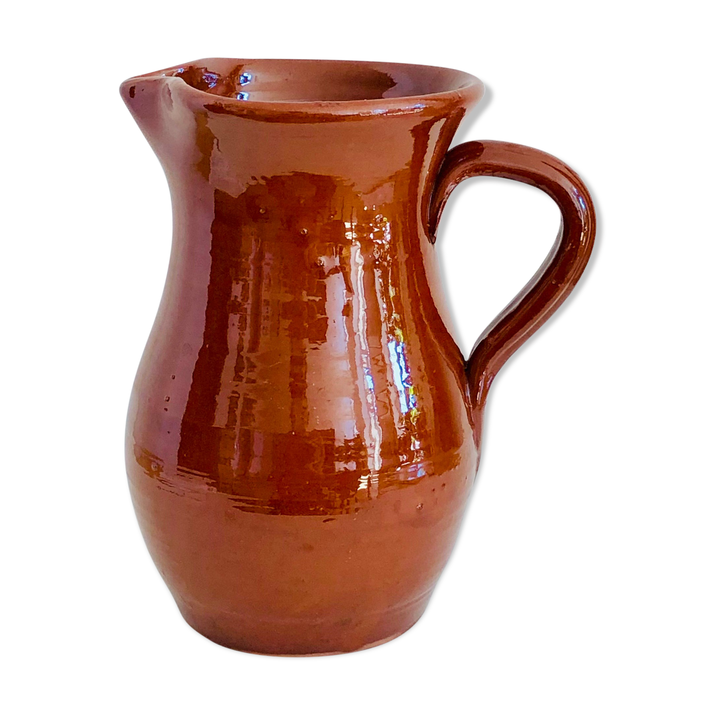 Vintage pitcher in glazed earth
