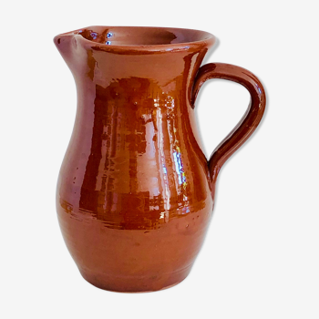 Vintage pitcher in glazed earth