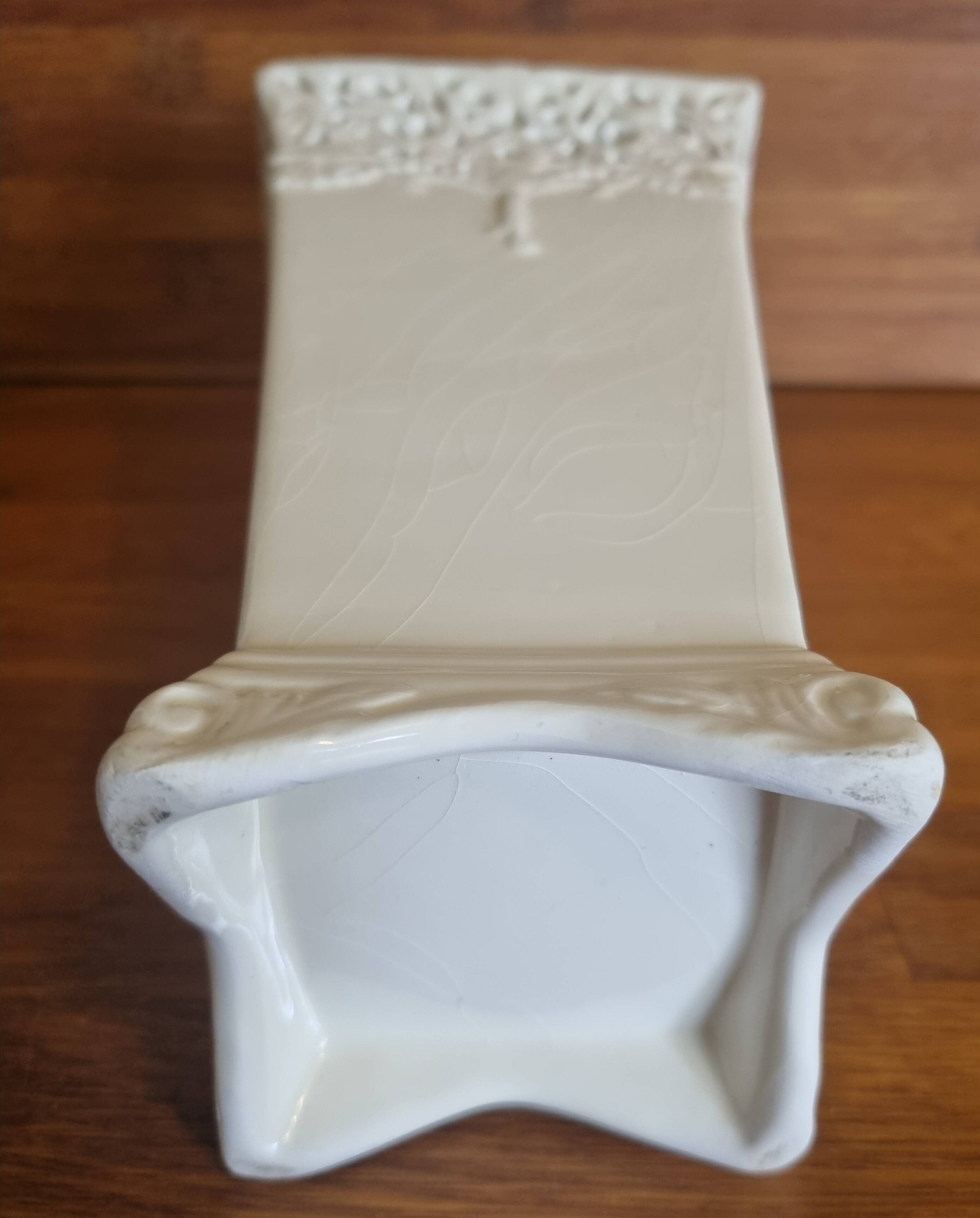 Vintage ceramic vase with lace edge