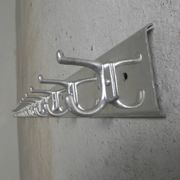 Wall-mounted aluminium coat rack of 225 cm with 16 double hooks, 1960s.