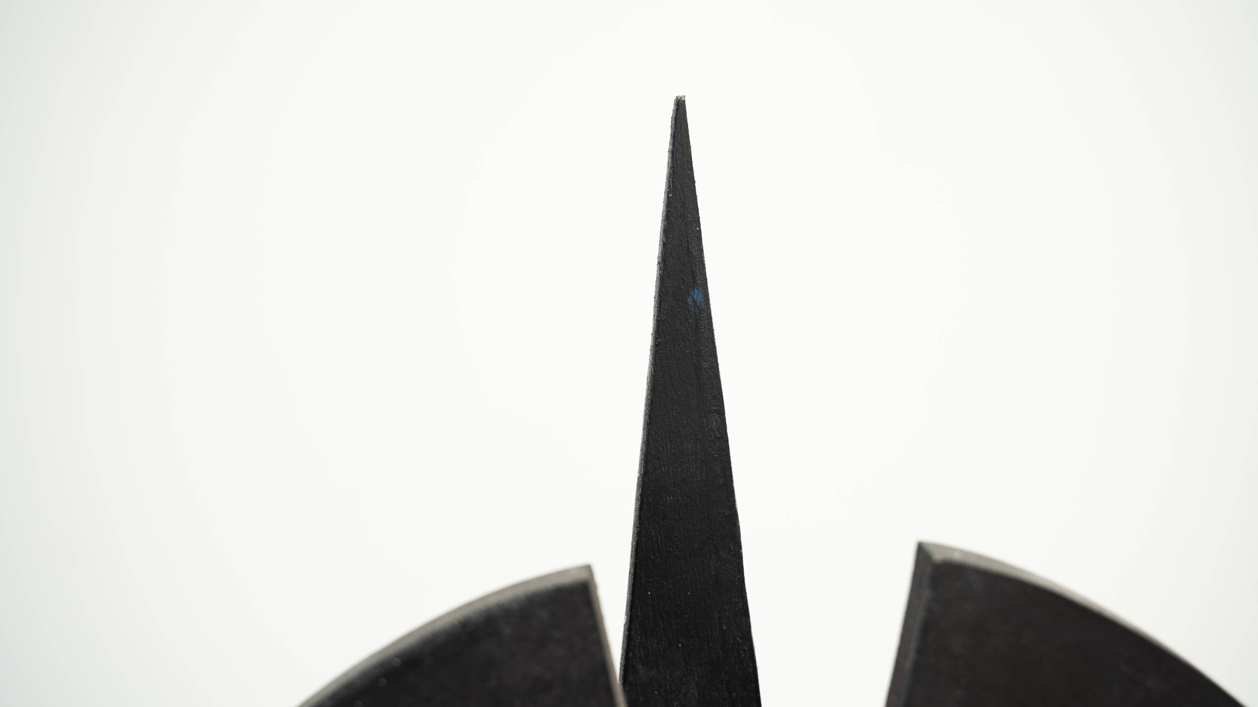 Black brutalist wooden sculpture