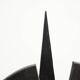Black brutalist wooden sculpture