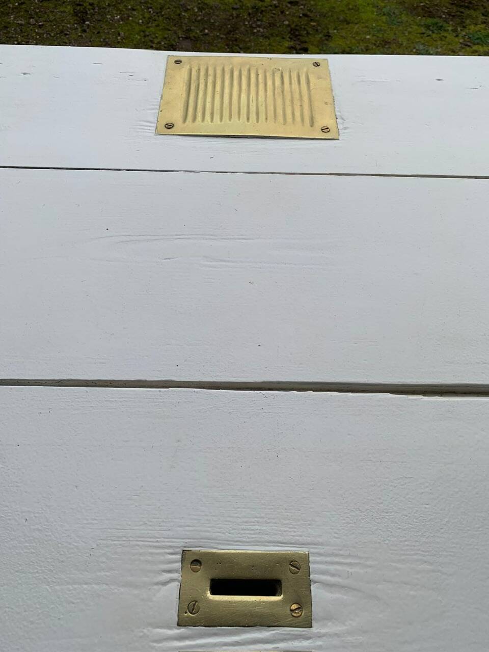 White counter with brass coin mechanism