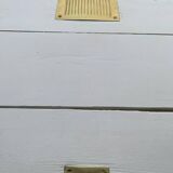 White counter with brass coin mechanism