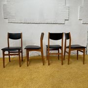 4 Scandinavian chairs in teak and black faux leather.