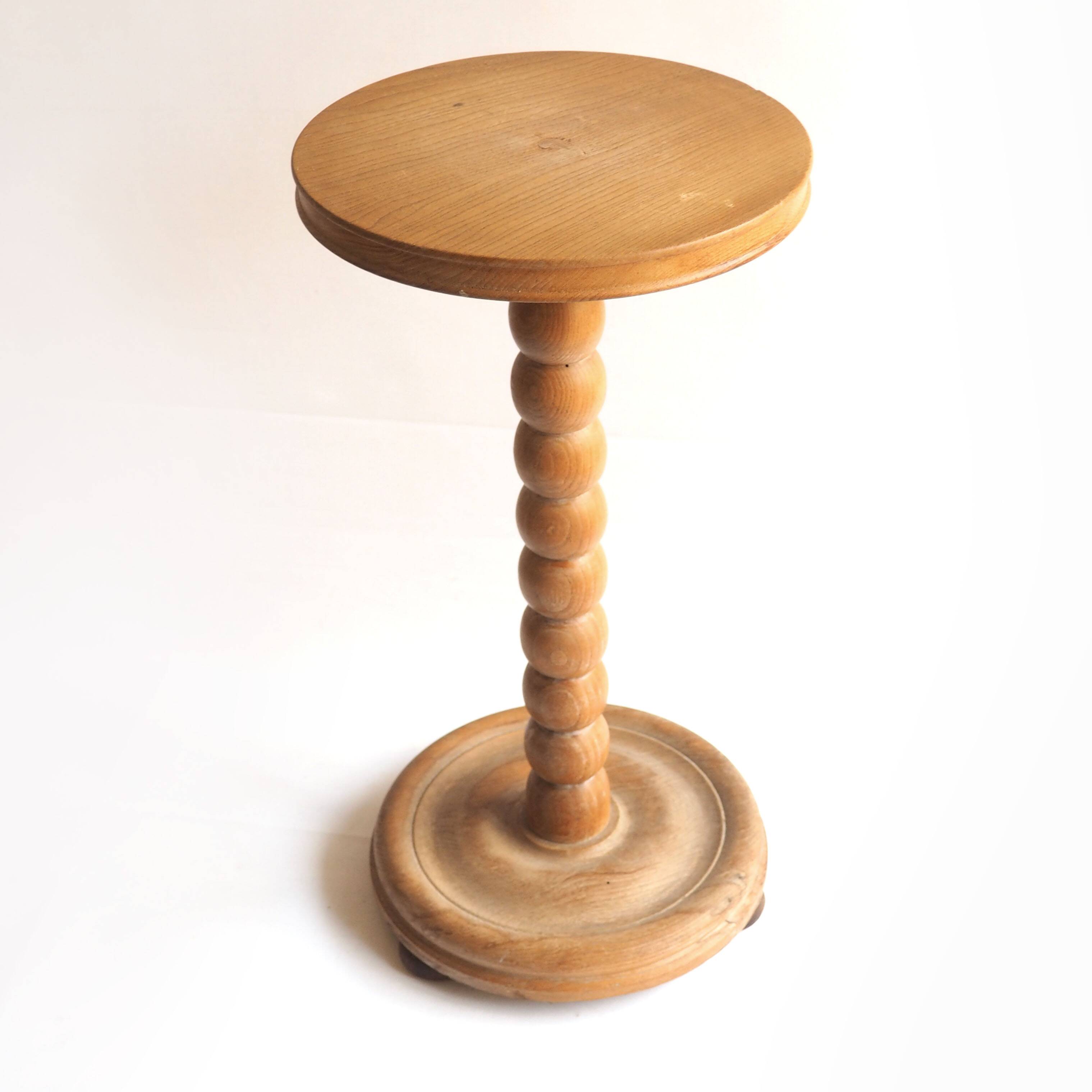 Beaded wood pedestal table