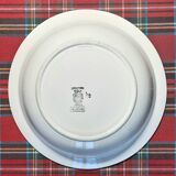 Old mismatched earthenware dinner plates accompanied by a deep dish