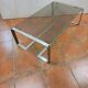 Coffee table with stainless steel base and smoked glass, from the 70s