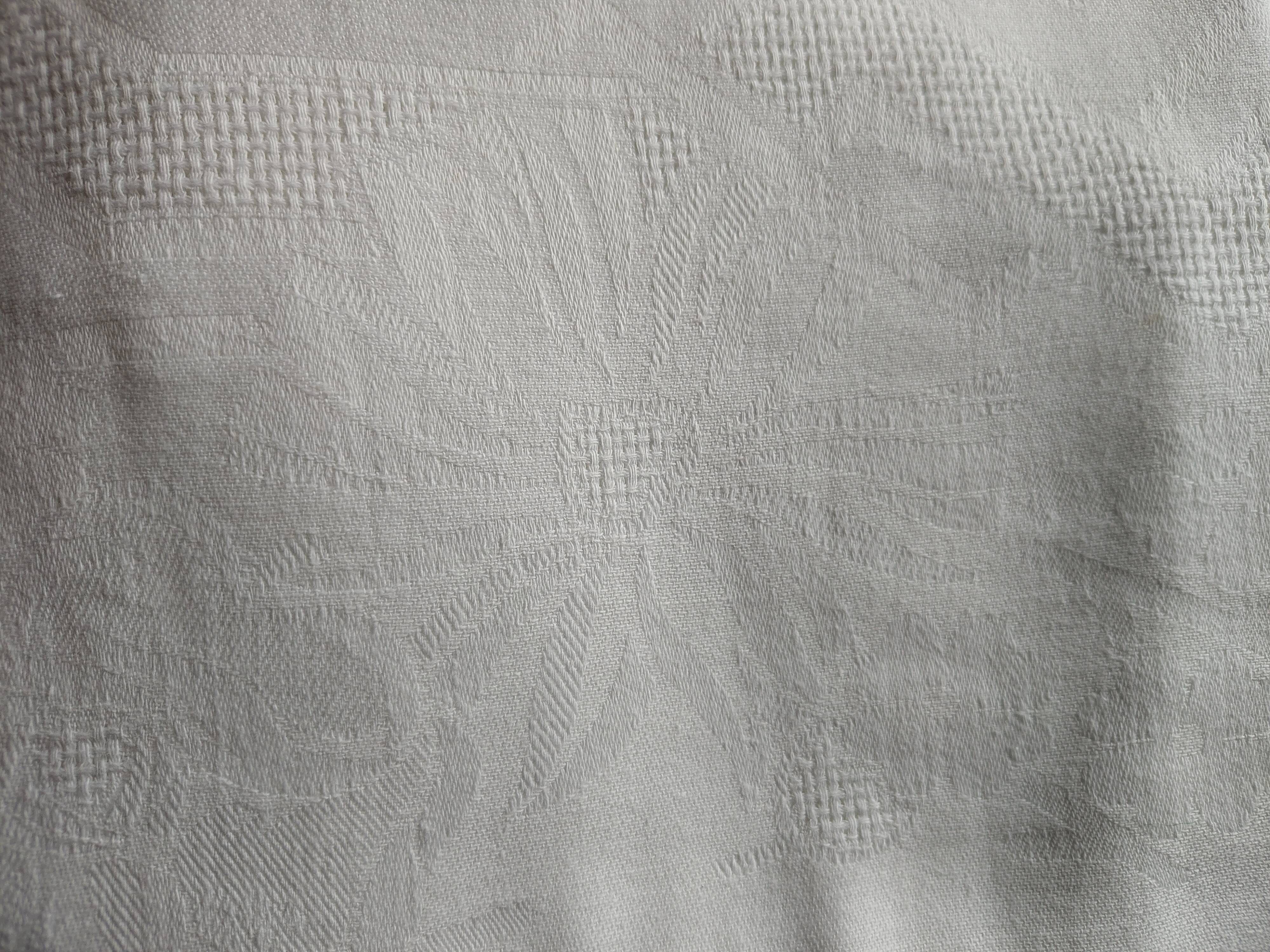 Old white damask cotton tablecloth