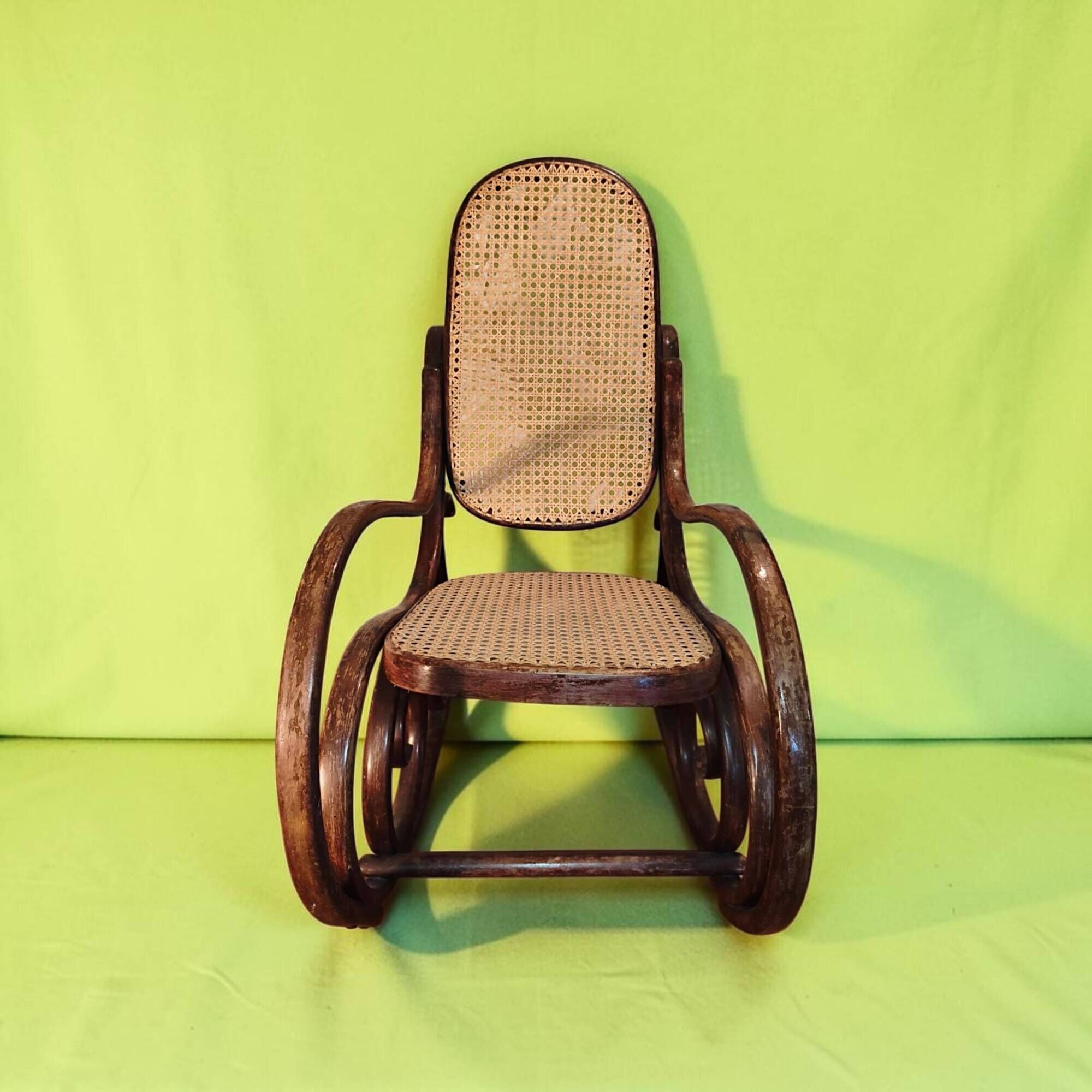 Antique curved wooden rocking chair with caning in Thonet style - Child size