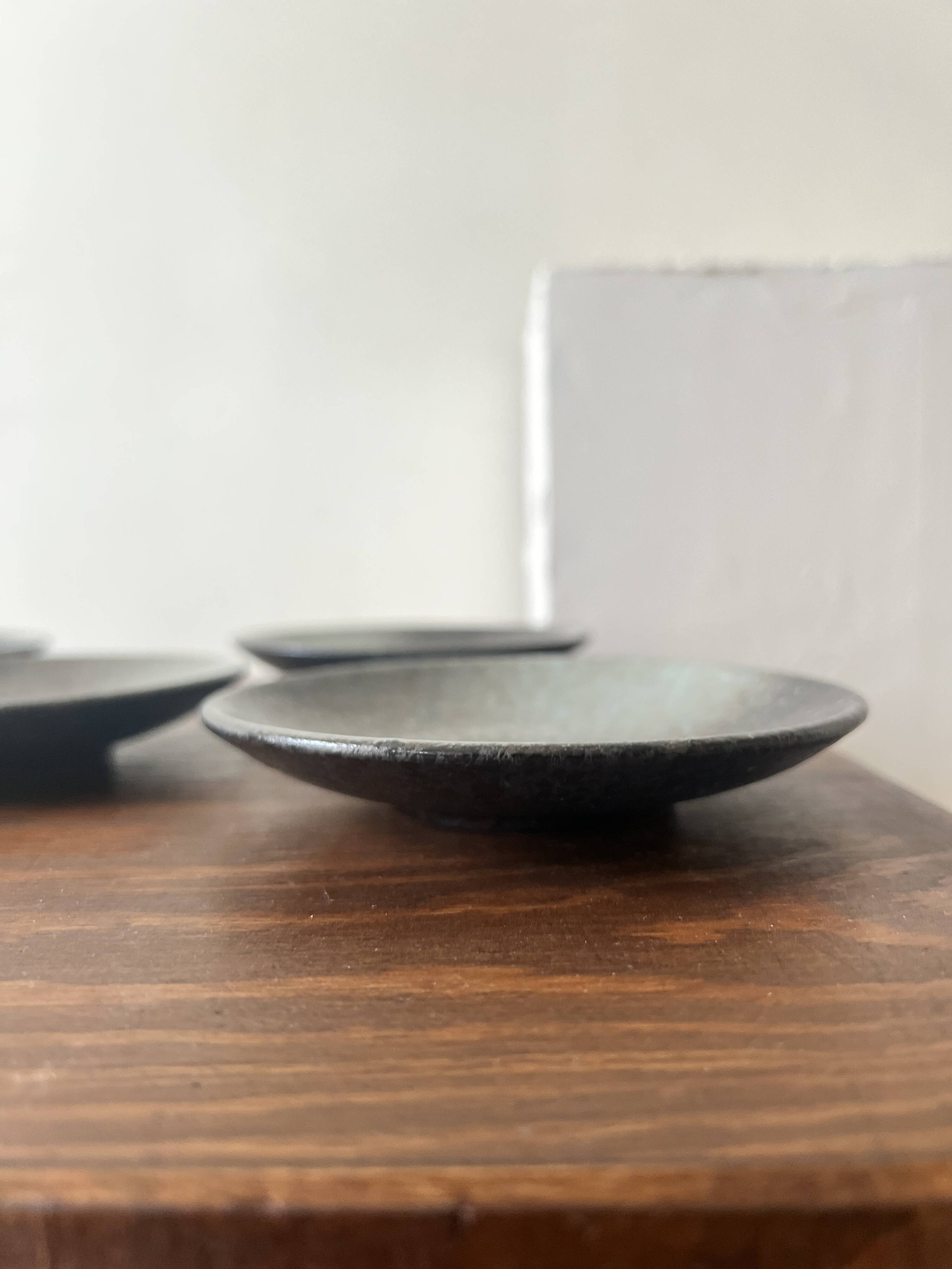Handmade round ceramic bowls made of Japanese stoneware.
