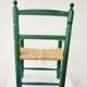 Small vintage children's chair in wood and green straw