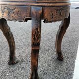 Old wooden saddle pedestal table with claw feet