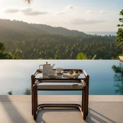 Vintage nesting tables in rattan and smoked glass by Flecht-Atelier Schütz.