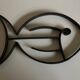 Modernist fish trivet in beaten iron, 1960.