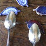 A set of 4 handcrafted pottery knife rests in blue.