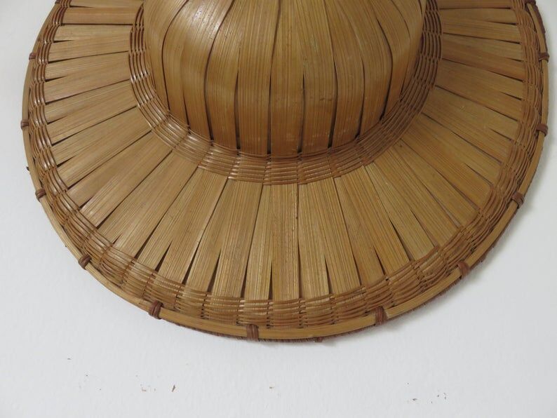 Colonial hat in bamboo and braided rattan, wall decoration