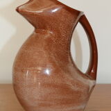 Brown painted earthenware pitcher