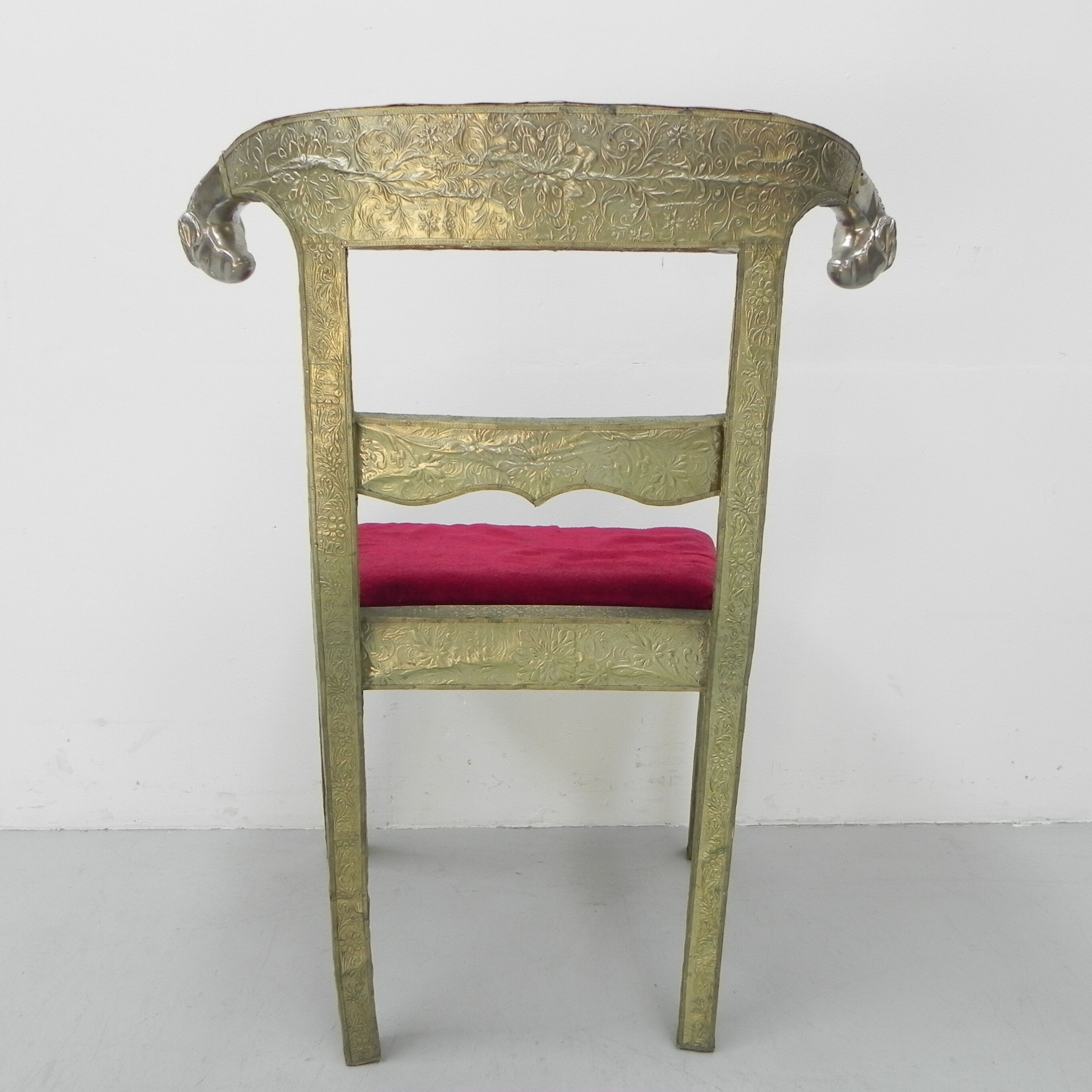 Dining chair upholstered with stamped tin