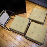 Mat black metal coffee table and 4 stackable stools.