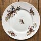 Set of 7 dessert plates in porcelain, butterfly pattern and wheat sheaves.
