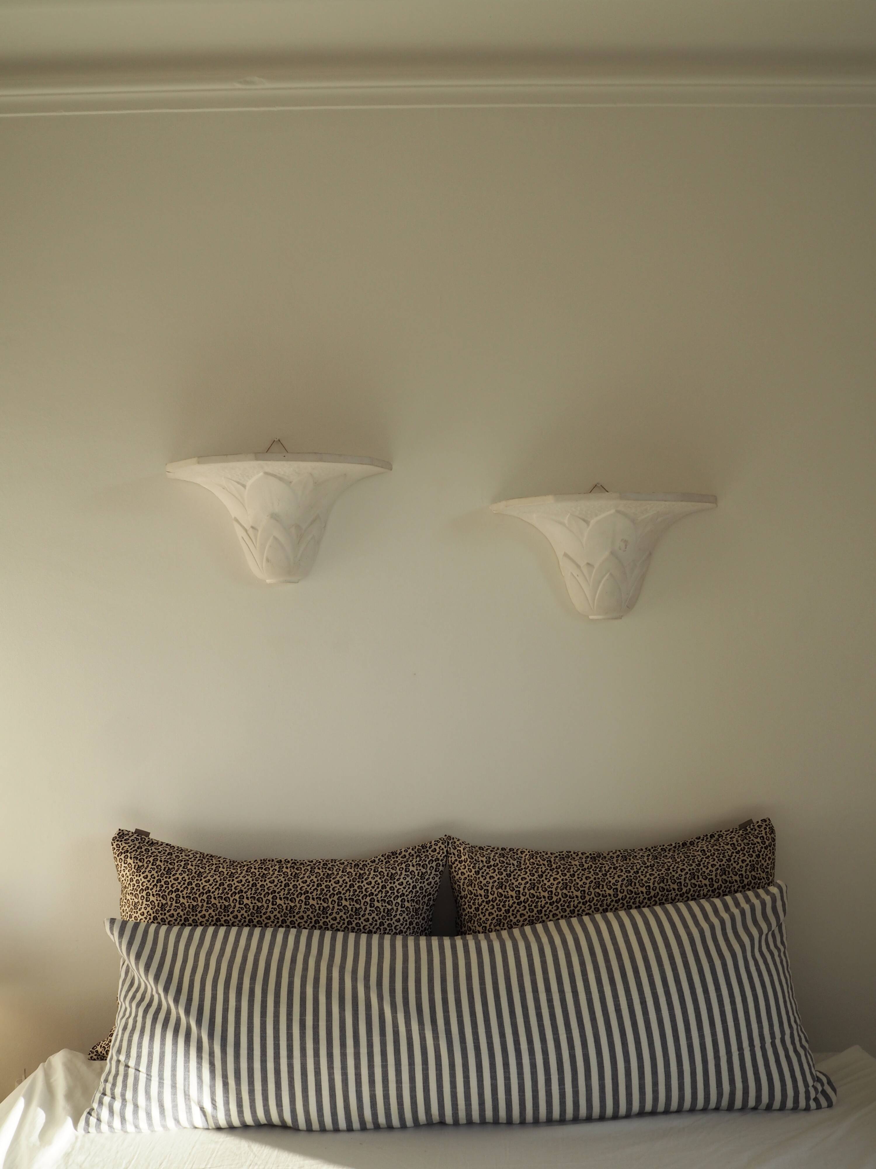 Pair of plaster wall sconces, palmette decoration, 20th century