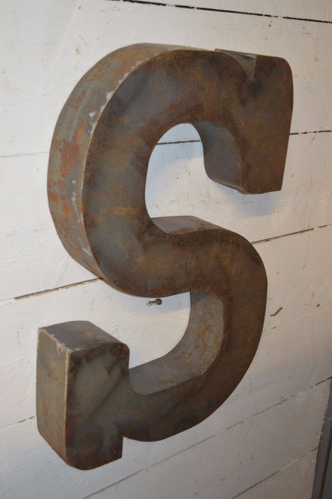 Industrial letter "s" in iron