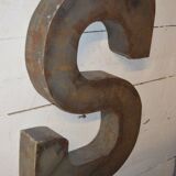 Industrial letter "s" in iron