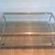 Table basse à double plateau en chrome et laiton