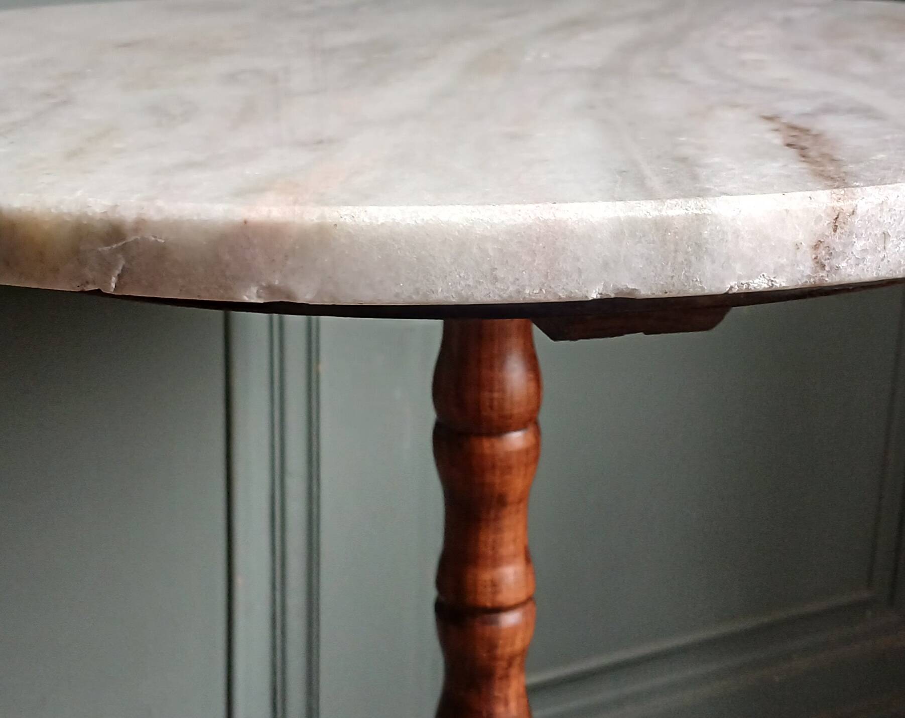Turned solid wood side table stained with a quartz top.