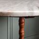 Turned solid wood side table stained with a quartz top.