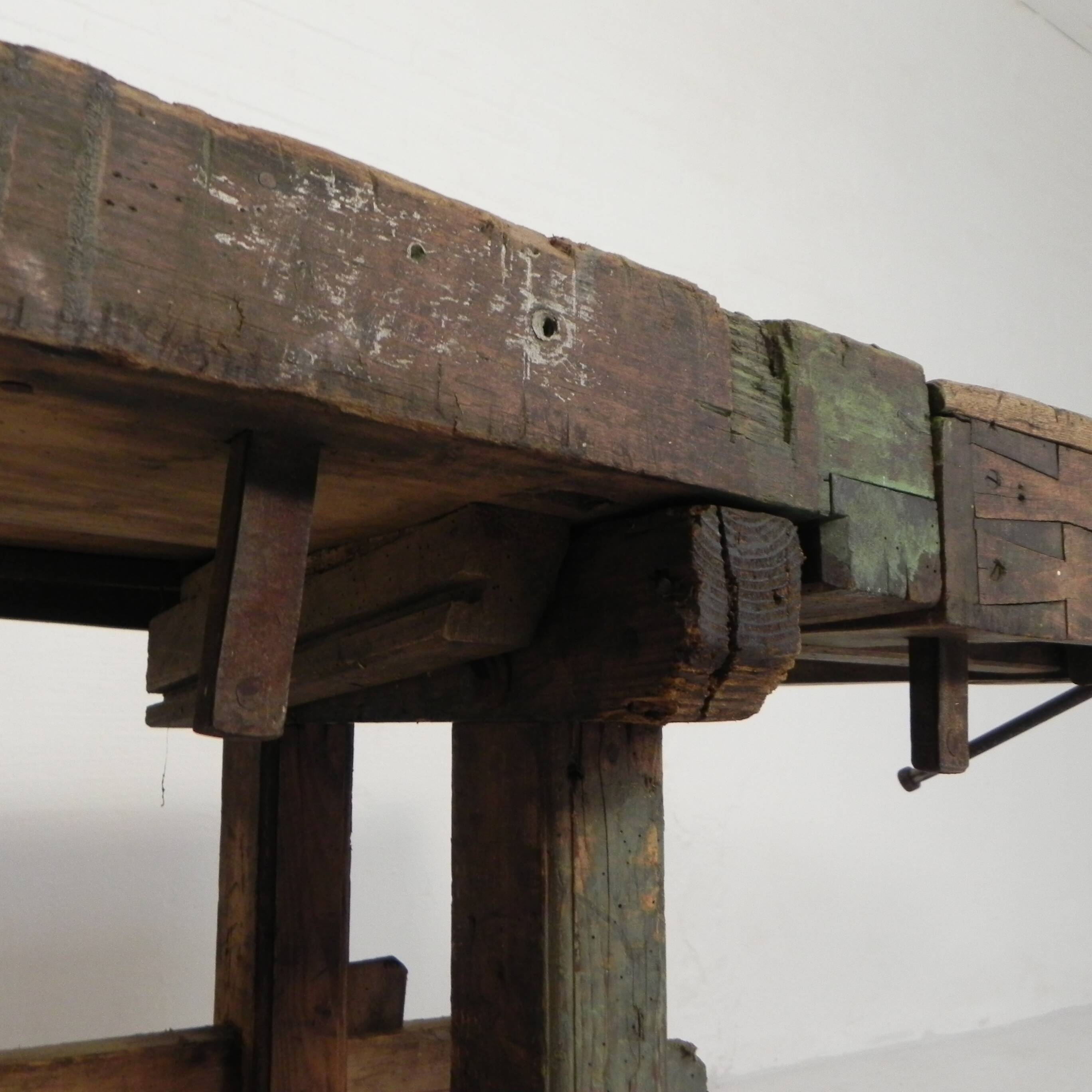 Wooden industrial workbench with vice, 194 cm long, 1930s.