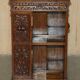 Victorian carved oak revolving library, circa 1880.