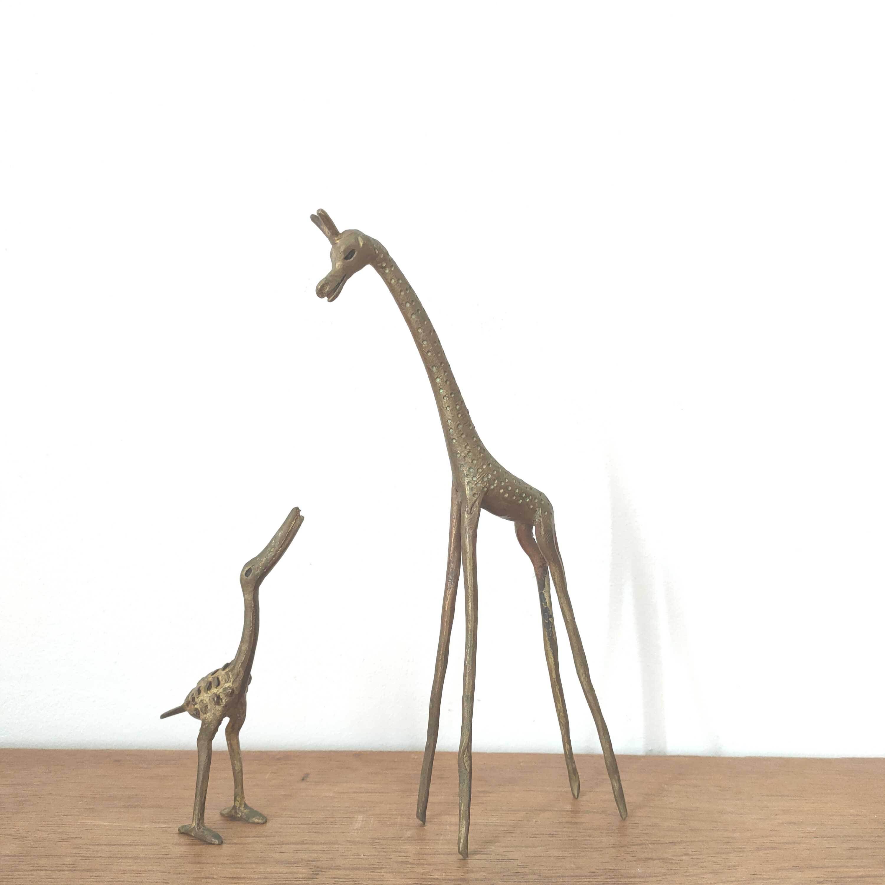 Giraffe and brass bird