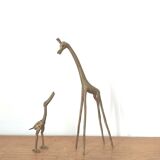 Giraffe and brass bird