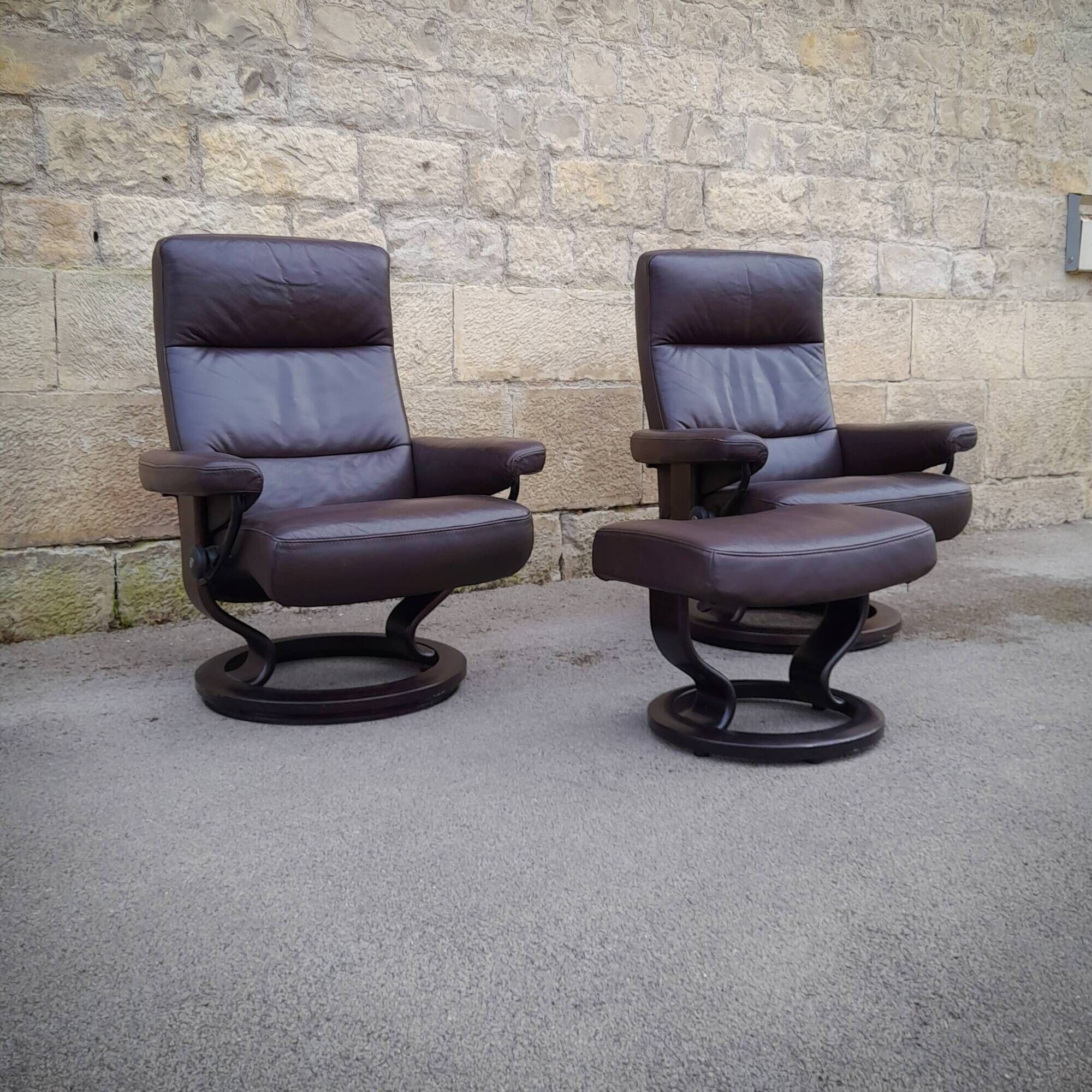 Pair of Scandinavian leather armchairs and ottoman, Ekornes, Norway, 1970