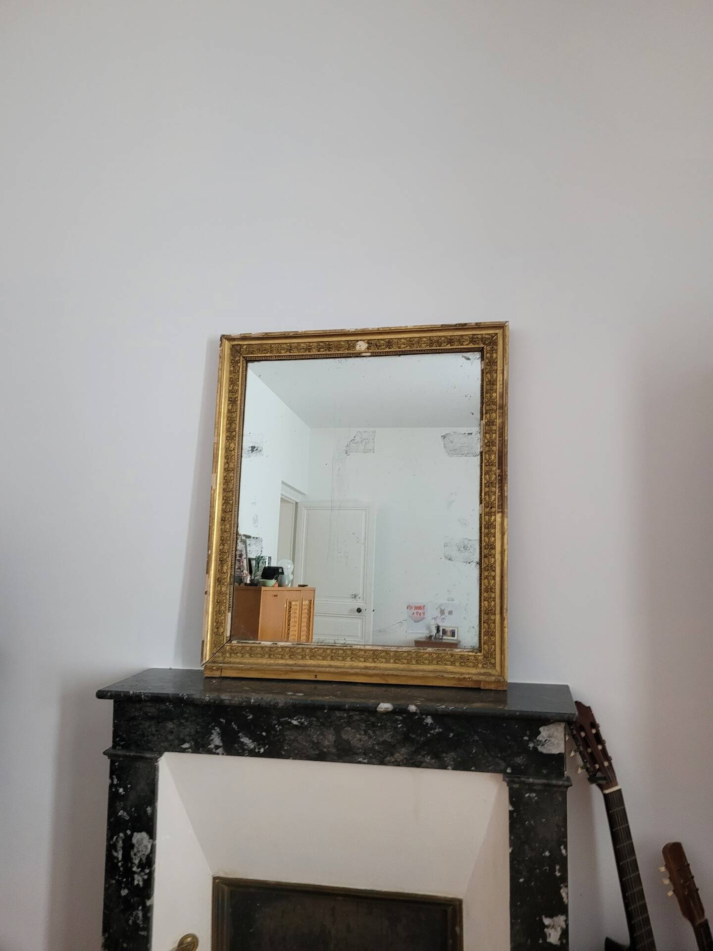 Golden stucco and wood Empire mirror