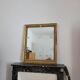 Golden stucco and wood Empire mirror