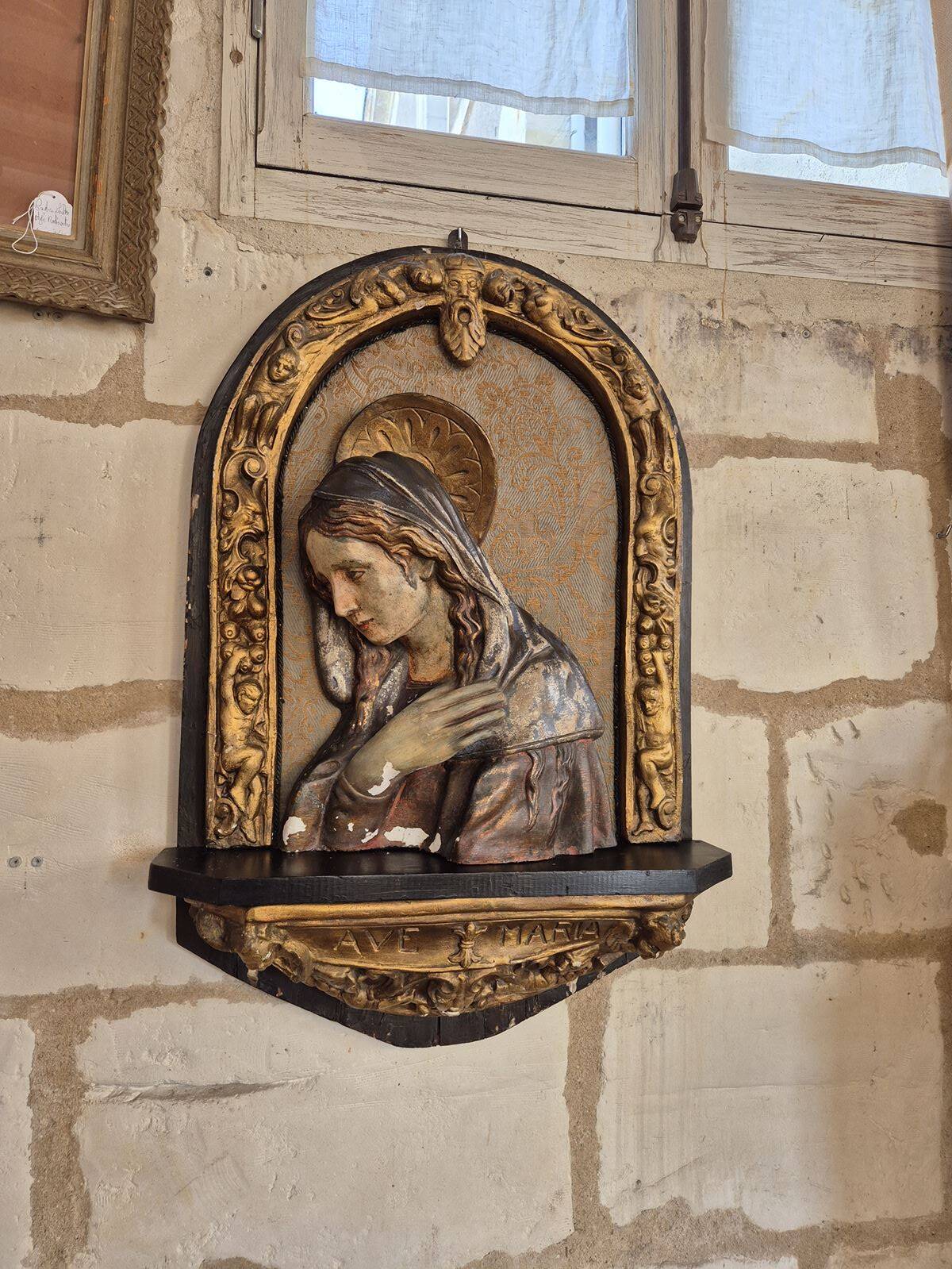 Ancient bas-relief in wood and stucco