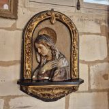 Ancient bas-relief in wood and stucco
