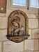 Ancient bas-relief in wood and stucco