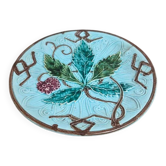 Old small compote dish in turquoise majolica with raised floral decoration.