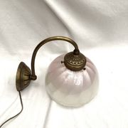 Brass wall light with a glass globe dimension: height -21cm- width -27cm-