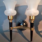 Pair of two-light torchiere wall lights in black lacquered metal and gilded brass, Circa 1960.