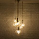“Cascade” brass chandelier with amber globes