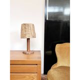 Lamp base in saddle stitched leather and raffia lampshade.