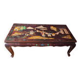 Black lacquered Chinese coffee table with figurative decoration – Coromandel style – 20th century